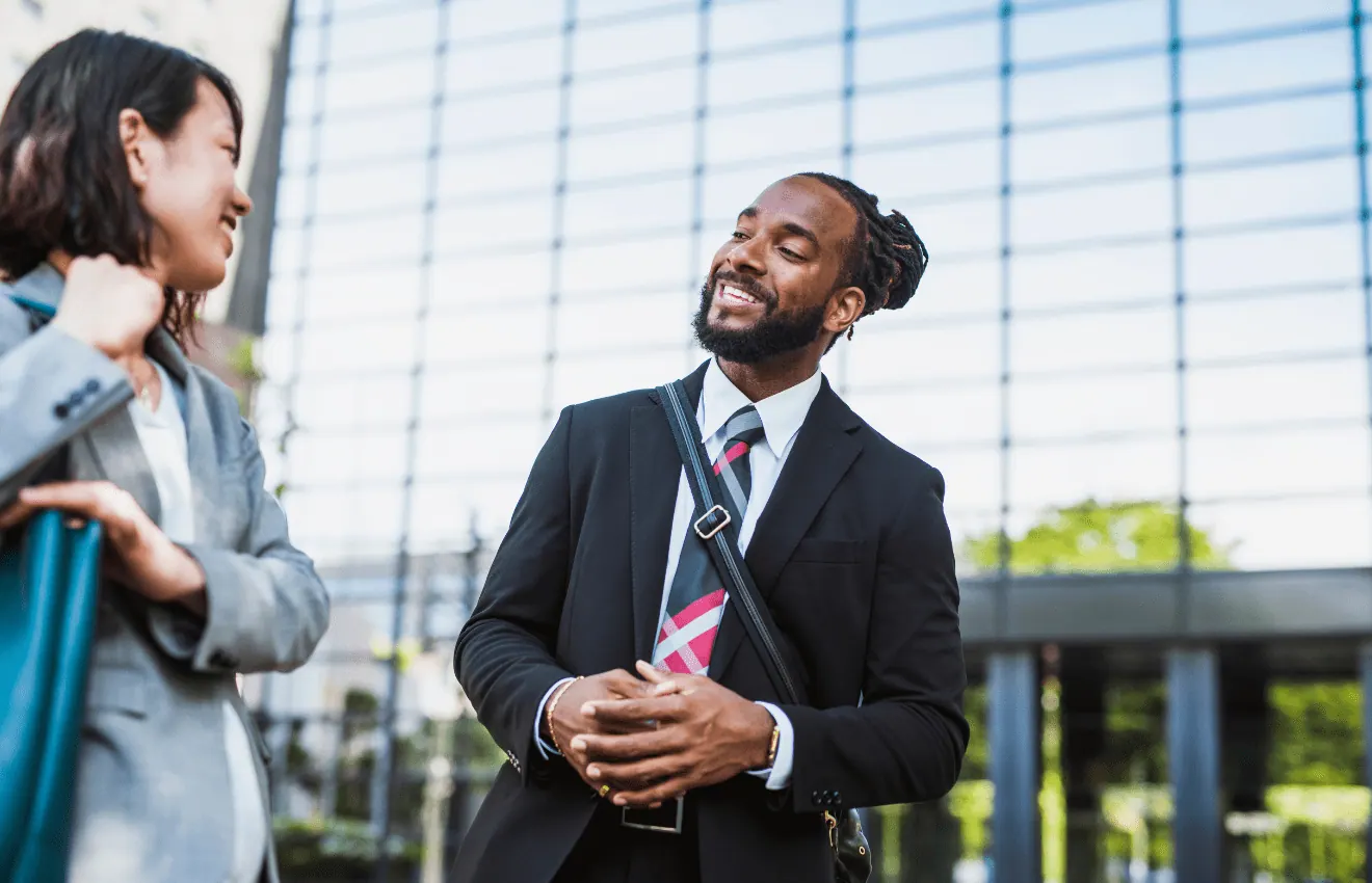 Two business people talking_ Questions to Ask Your Real Estate Agent