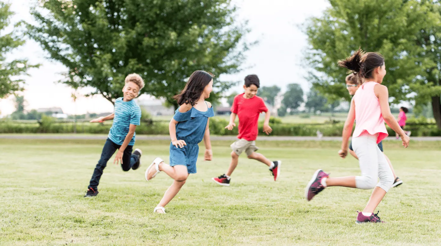 elementary school kids playing in the park